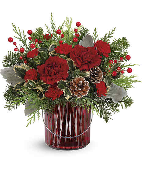 maroon carnations, miniature red carnations, variegated holly, dusty miller, noble fir, and cedar, accented with festive flair in a marron glass vase.