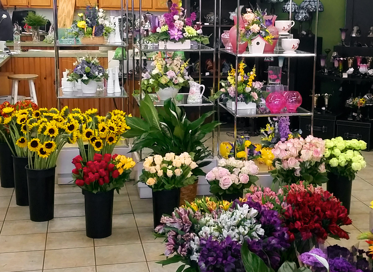 A wide range of colorful floral arrangements, awaiting their new home